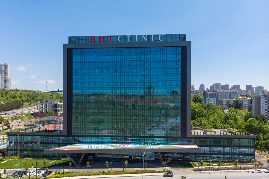 BHT Clinic Tema exterior — 19-storey glass façade in Atakent, Küçükçekmece, Istanbul. JCI-accredited, TEMOS-certified, LEED Gold.